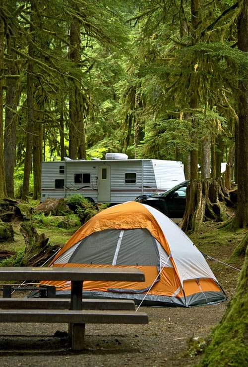 tent and trailer at a campground