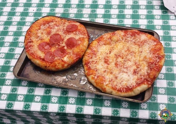 2 pizzas on a baking sheet