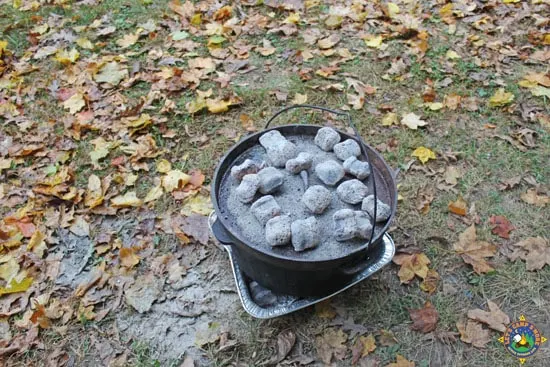 Dutch oven with charcoal on the lid