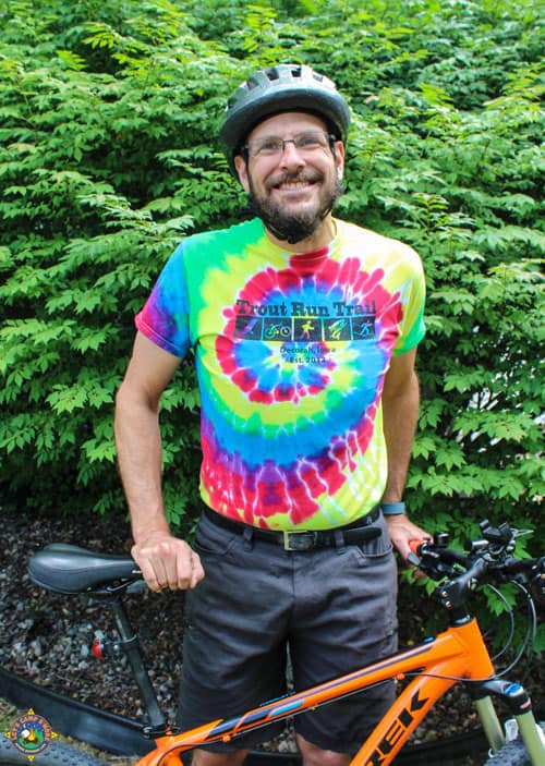 smiling man wearing a Trout Run Trail t-shirt