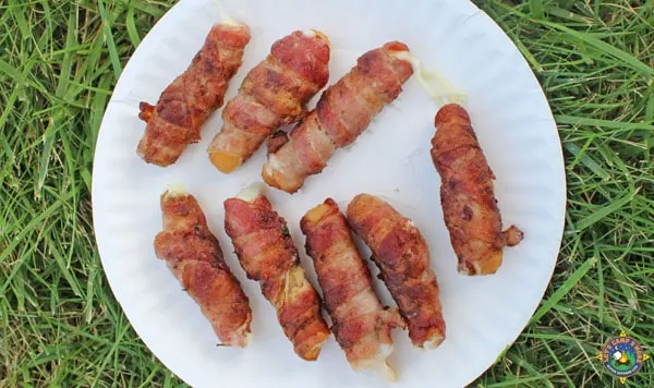 bacon mozzarella sticks on a plate