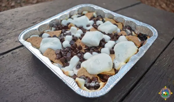 pan of s'more nachos on a picnic table