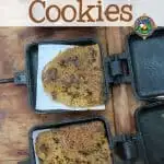 Campfire Cookies - Do you want home-baked cookies while camping? Make these Campfire Cookies using a pie iron over the fire. Get the kids to help with this fun and easy camping dessert. Just make sure you prep enough cookie dough because they will disappear quickly!
