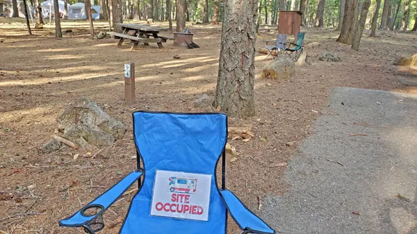 Site Occupied Free Camping Printable on a Camping Chair