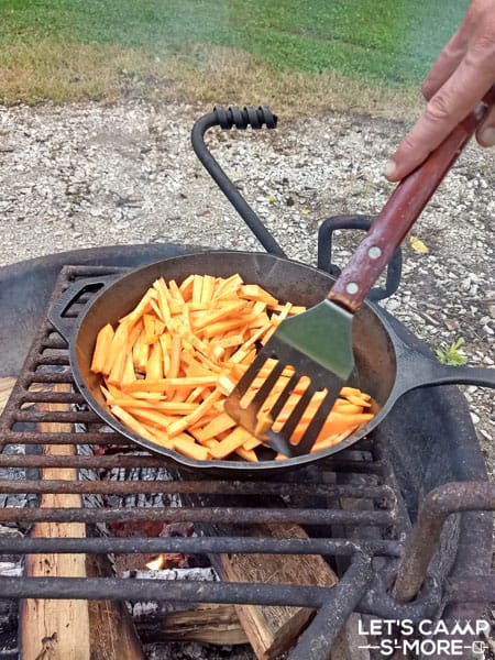 Sweet Potato Fries being cooked over a campfire