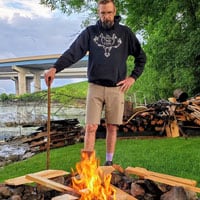 a man by a campfire