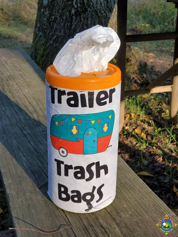 trailer park trash bag container on a picnic table