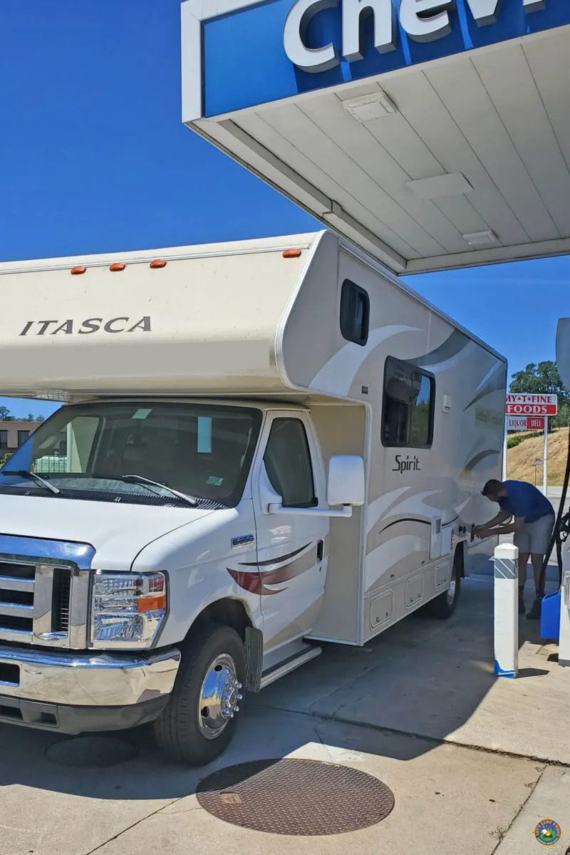 motorhome being filled with gas at a gas station