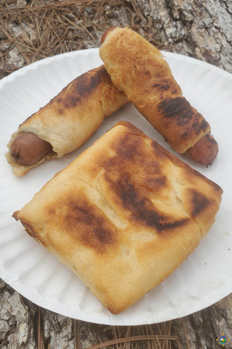 Campfire hot dogs wrapped in dough