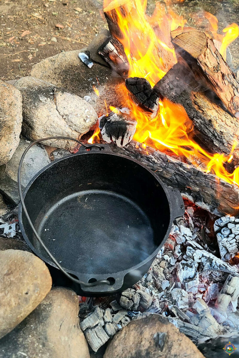 heating a dutch oven over a campfire