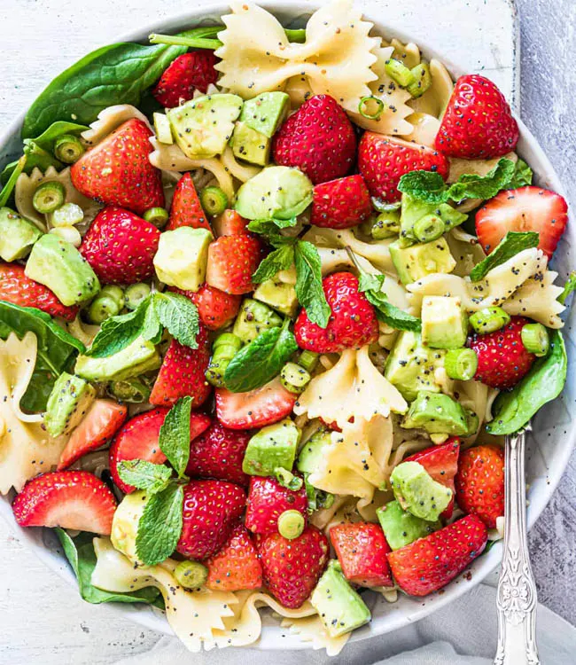 Strawberry avocado pasta salad in a bowl