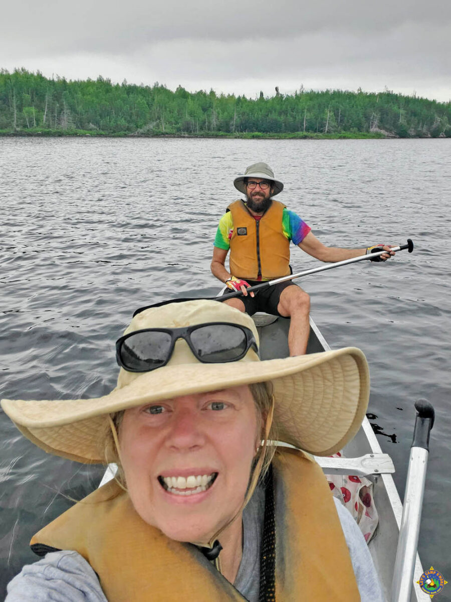 couple canoeing in boundary waters in minnesota