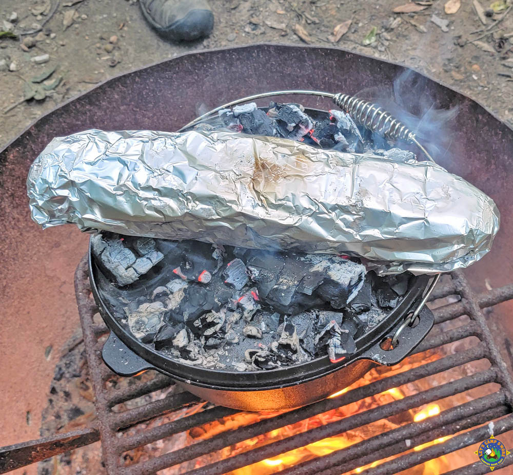 Spaghetti in a Dutch Oven and Bread Wrapped in Foil over a Campfire
