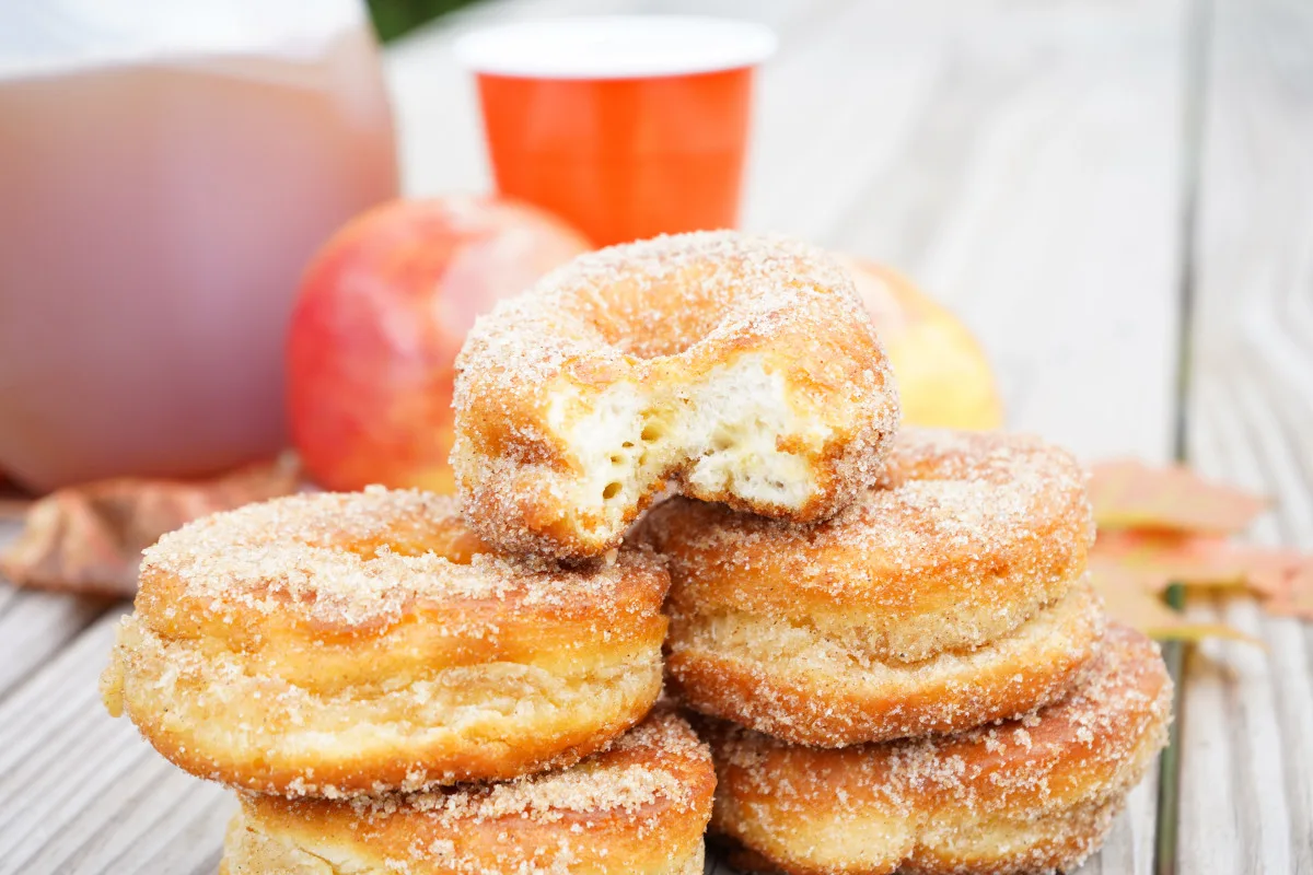 stack of homemade donuts and apples