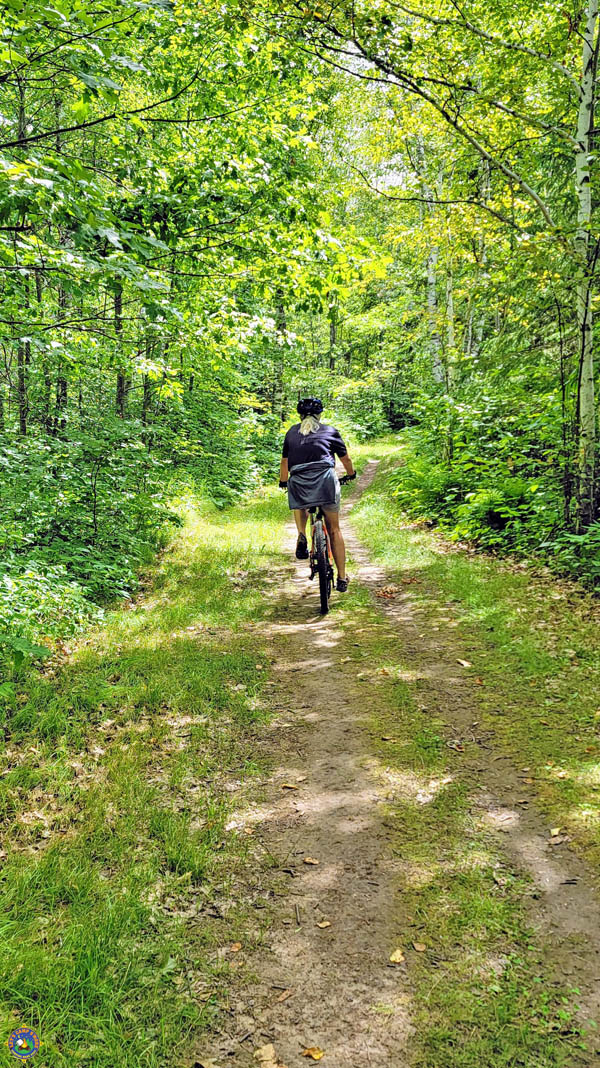 woman biking on trails in Minnesota