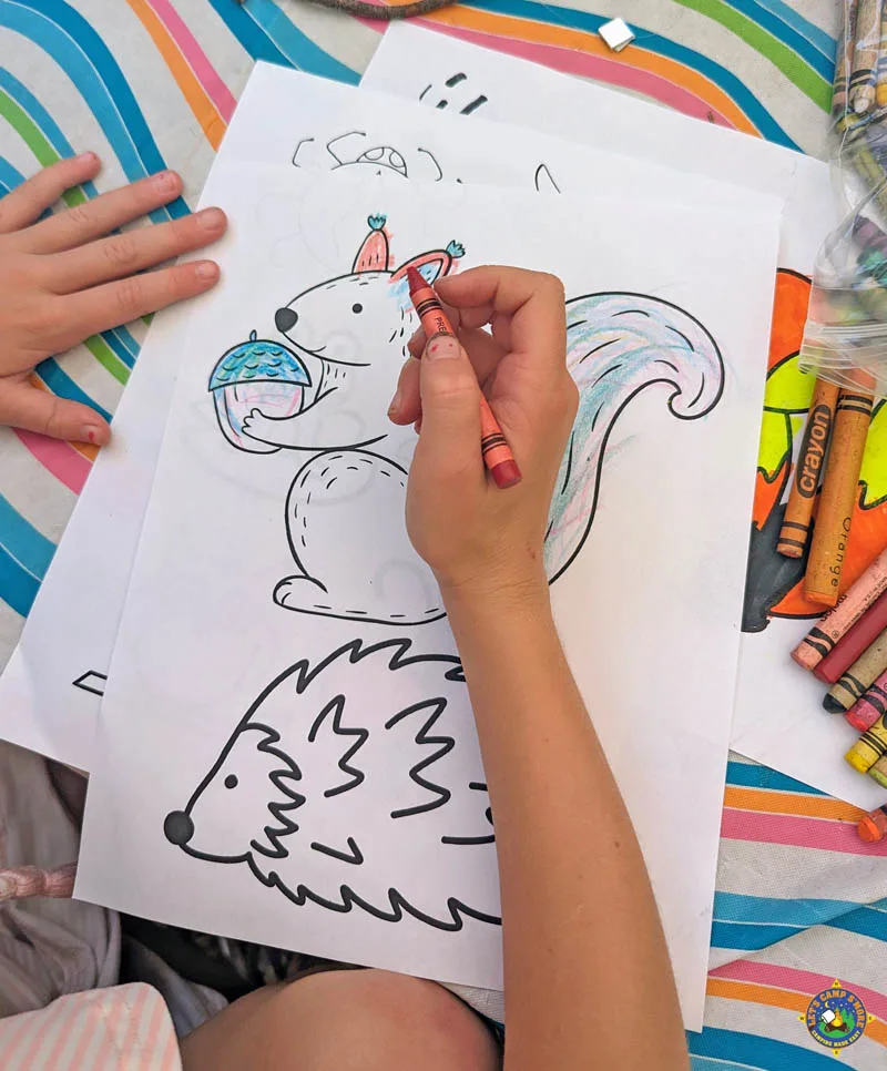 camping animals coloring page being colored