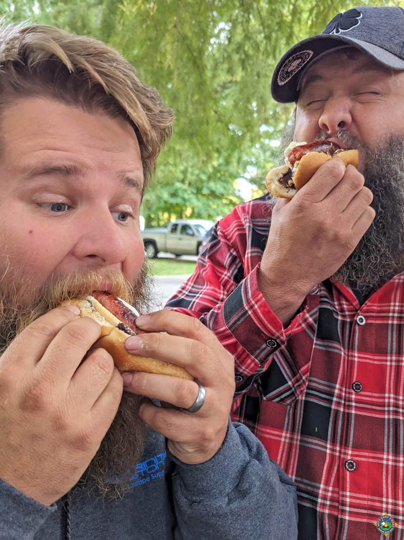 dudes eating hot dogs